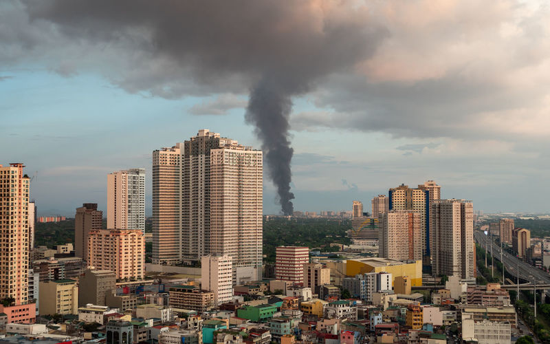 Smoke going up to sky from fire in manila - philippines