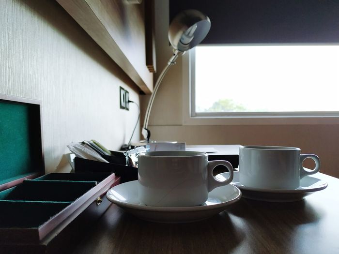 Coffee cups on table at home