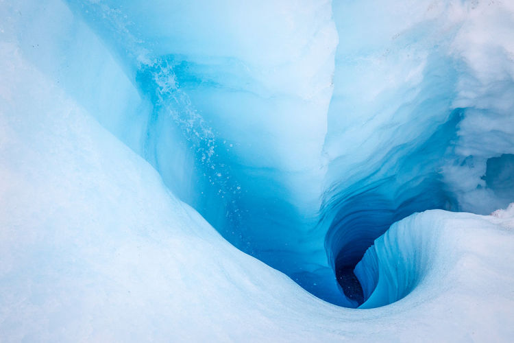 High angle view of glacier crevasse