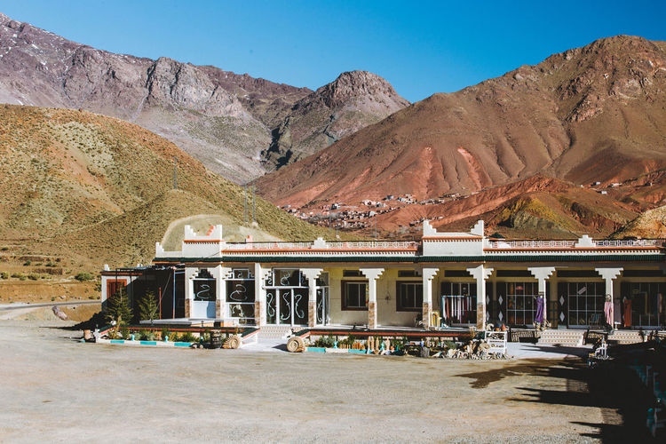 Scenic view of moroccan berber hostel in atlas mountains canyon, morocco, africa