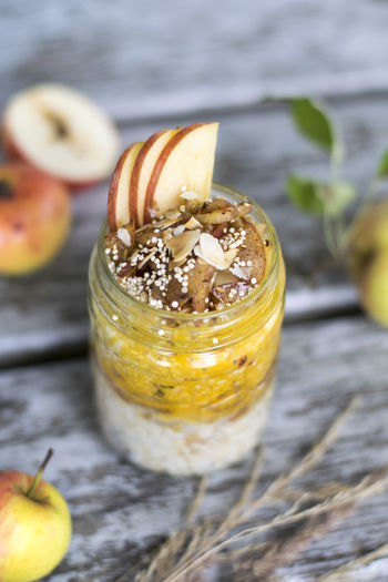 High angle view of apple porridge in jar on table