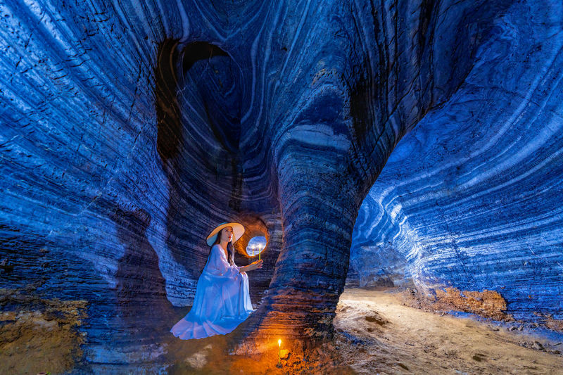 Digital composite image of woman in tunnel