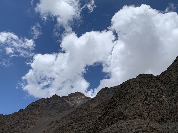 Low angle view of majestic mountains against sky