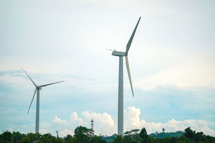 Low angle view of windmill against sky