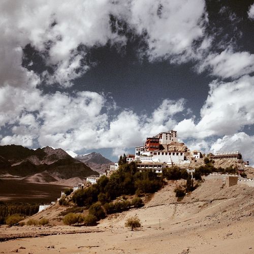 Key monastery on hill against cloudy sky