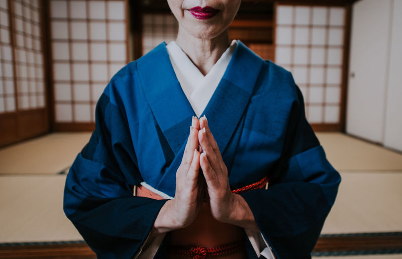Midsection of woman wearing mask