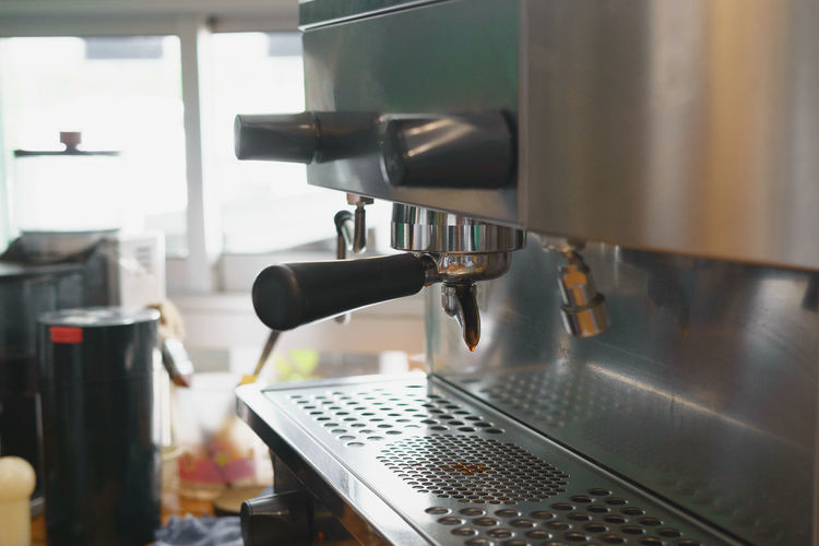 Close-up of espresso maker in cafe