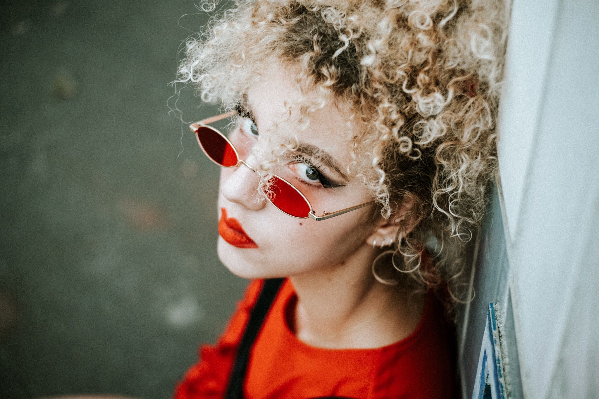 childhood, headshot, child, real people, one person, lifestyles, portrait, curly hair, indoors, hair, close-up, hairstyle, front view, leisure activity, red, glasses, mask - disguise, disguise, innocence