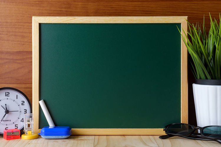 Close-up of blank blackboard on table