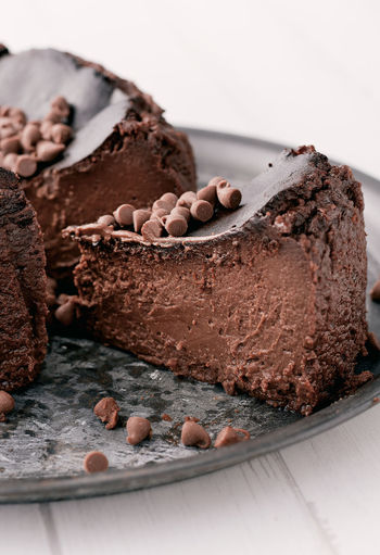 A piece of a chocolate basque burnt cheesecake close up
