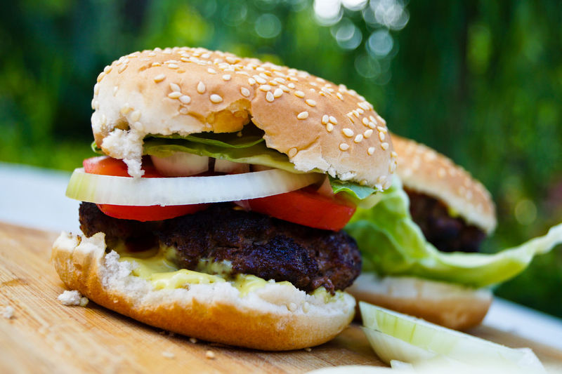 Close-up of burgers on cutting board