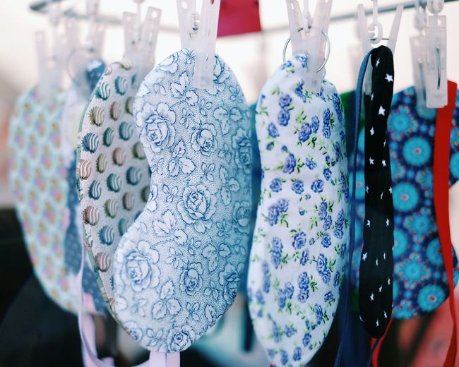 Close-up of sleeping masks hanging for sale at store