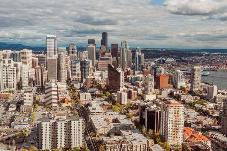 High angle view of modern buildings in city against sky