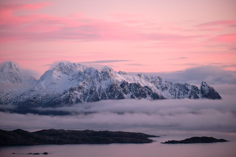 Scenic view of snowcapped mountains against sky during sunset