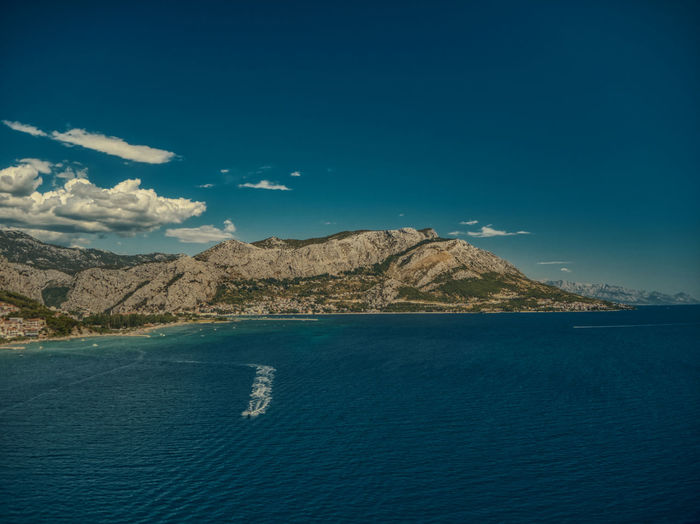 Scenic view of sea against blue sky