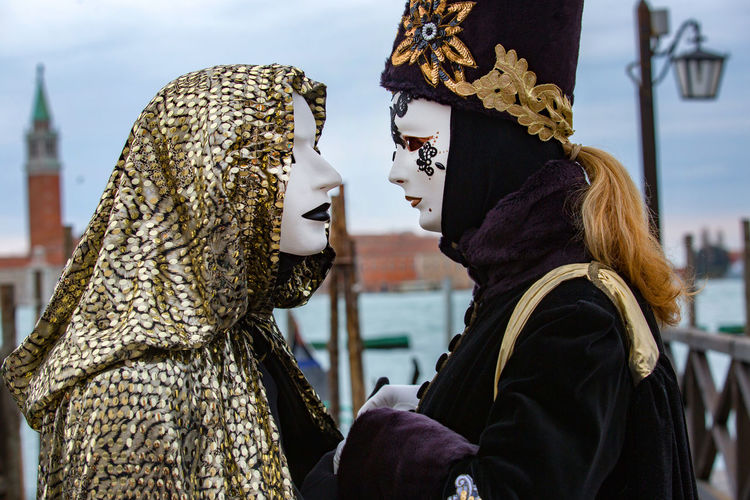 Side view of people wearing costume