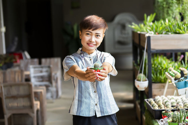 Portrait of smiling girl holding outdoors