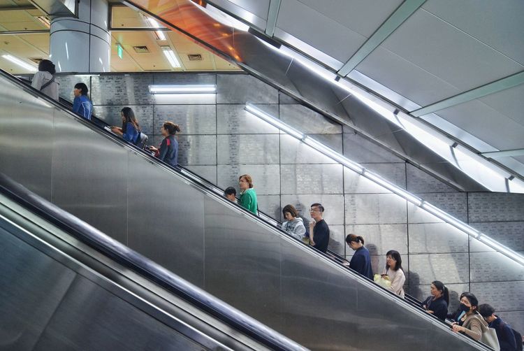 Group of people on escalator