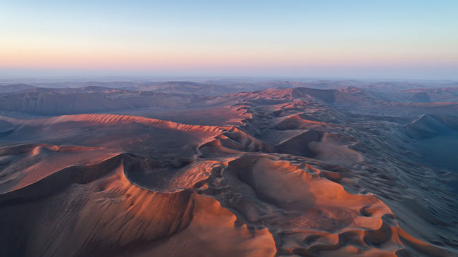 Aerial view of landscape during sunset