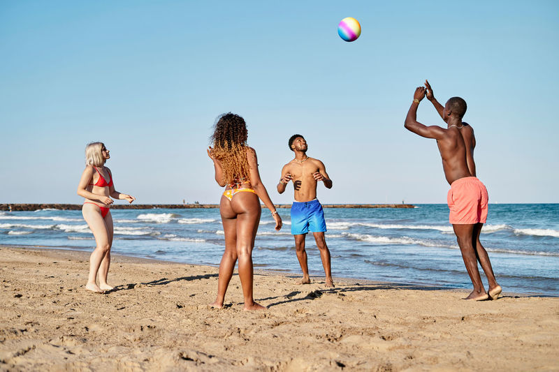 Friends playing at beach