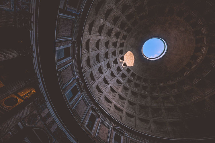 Low angle view of hole in ornate ceiling