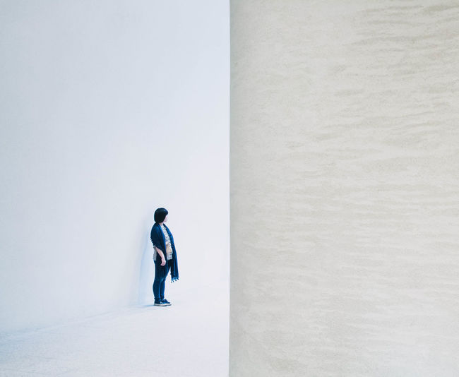 Full length of a man walking on built structure