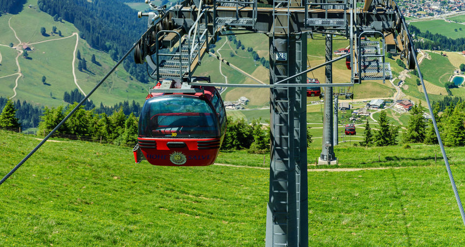View of overhead cable car on field