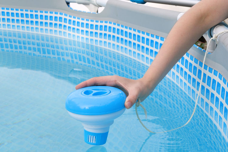 Midsection of woman holding water