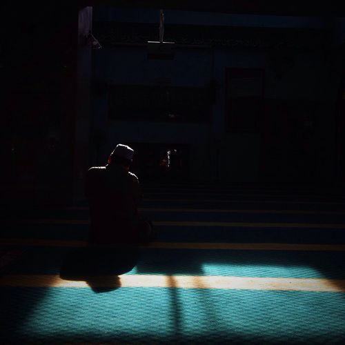 View of woman in dark room