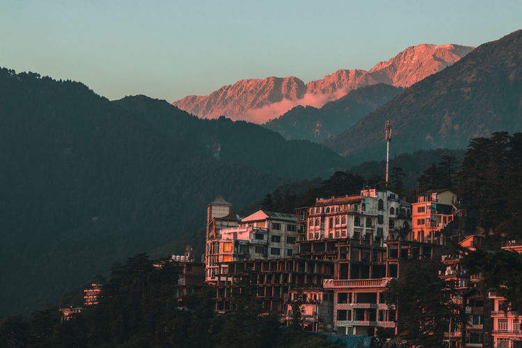 Buildings in town at sunset