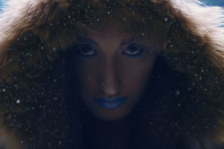 Close-up portrait of boy in snow
