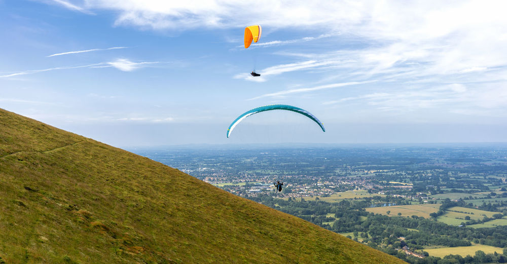 Paragliders flying from the malvern hills, malvern, uk