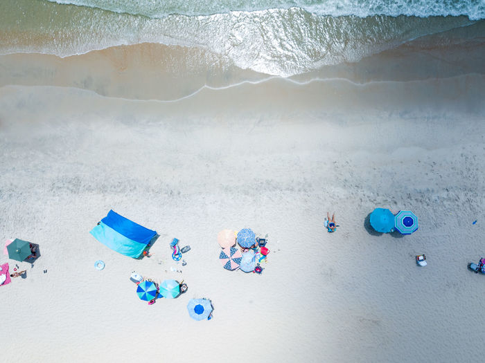 High angle view of beach umbrella on sea shore