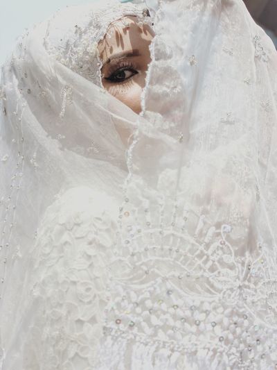 HIGH ANGLE VIEW OF WOMAN IN SNOW COVERED WITH HAT