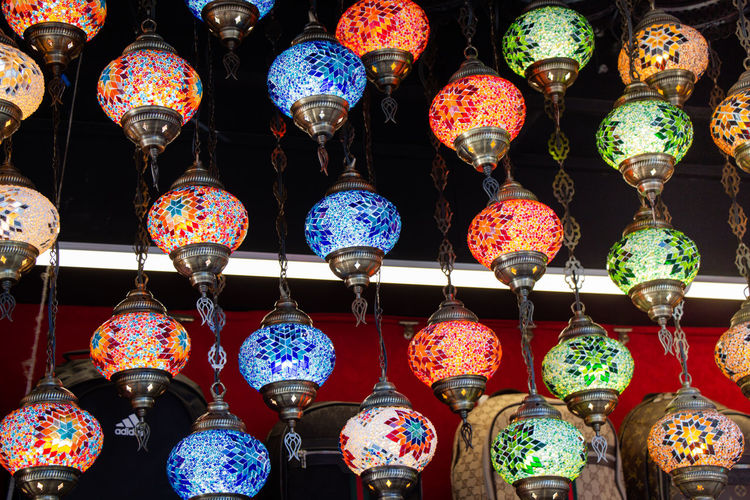Multi colored lanterns hanging at market stall