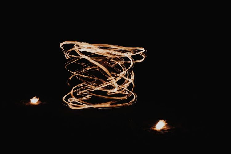 Fire dance in the dark long exposure 