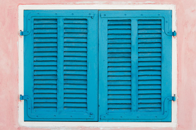 Closed blue window of building