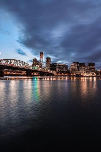 Illuminated city at waterfront