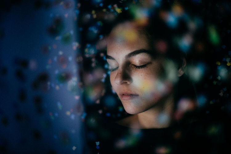 Woman in multi colored lights