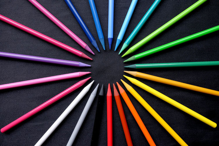 Directly above shot of colored pencils arranged on table