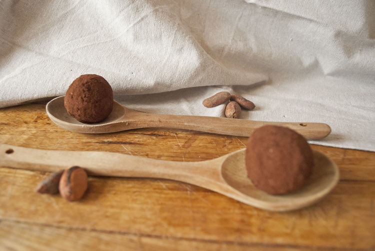 Chocolate energy ball, full of protein and healthy fats. sweet snack on wood board