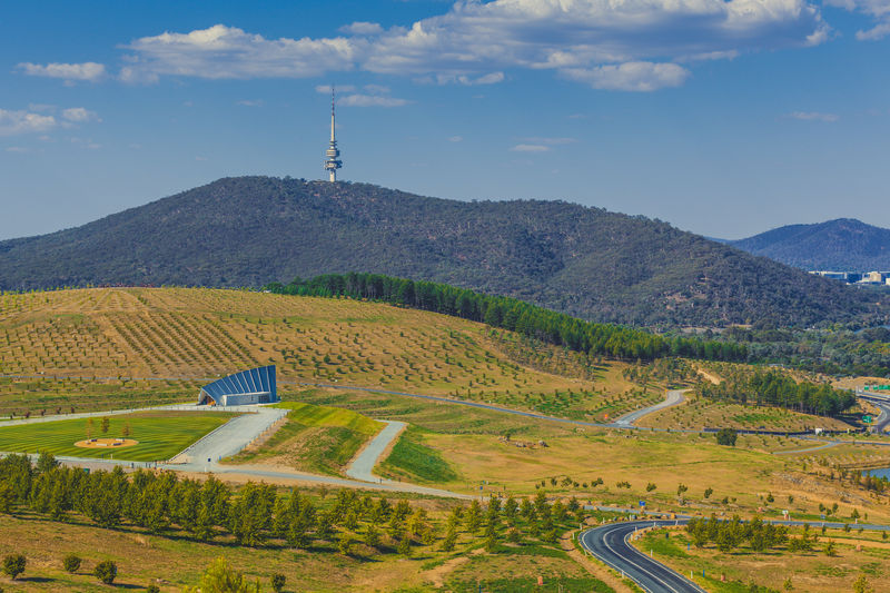 Landscape of national arboretum in canberra, with iconic telstra tower on black mountain, australia