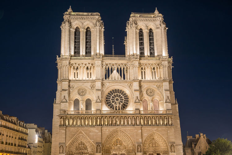 Notre dame de paris - famous cathedral with night illumination before fire april 15, 2019