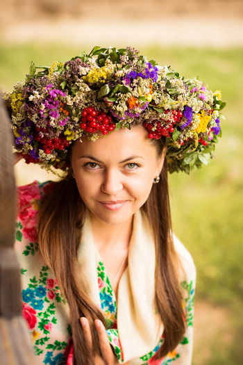 Young pretty ukrainian woman with a wreath of dry herbs on her head