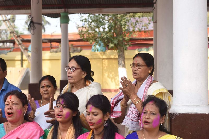 A group of women participates in a holi geet in barpeta, assam. 