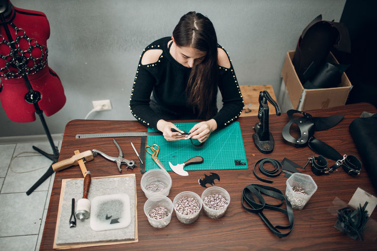 High angle view of woman working on table