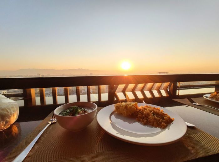High angle view of food on table against sky during sunset