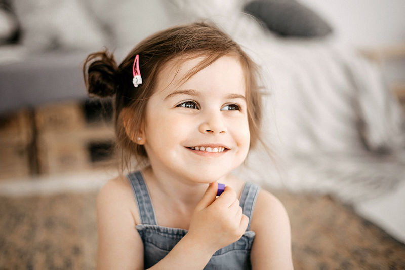 Portrait of a funny little girl with beautiful eyes and a smile.