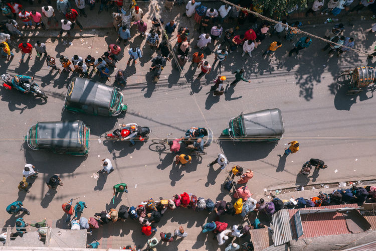 High angle view of people on street waiting for the vaccine in fornt of the hospital 