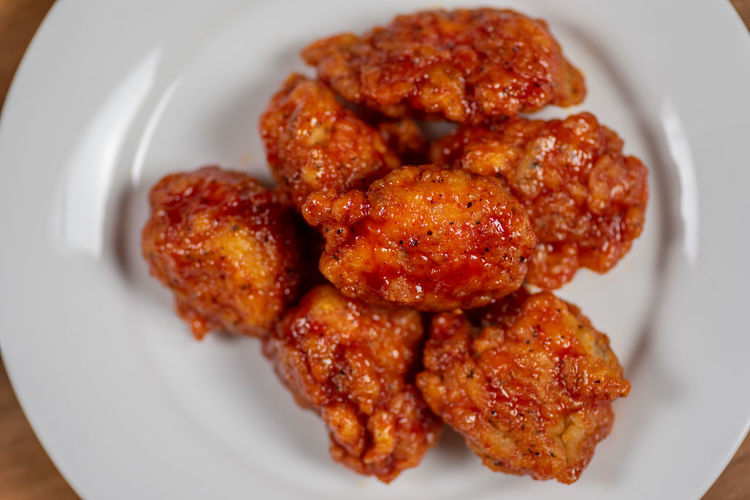 Plate of spicy hot boneless bbq chicken wings